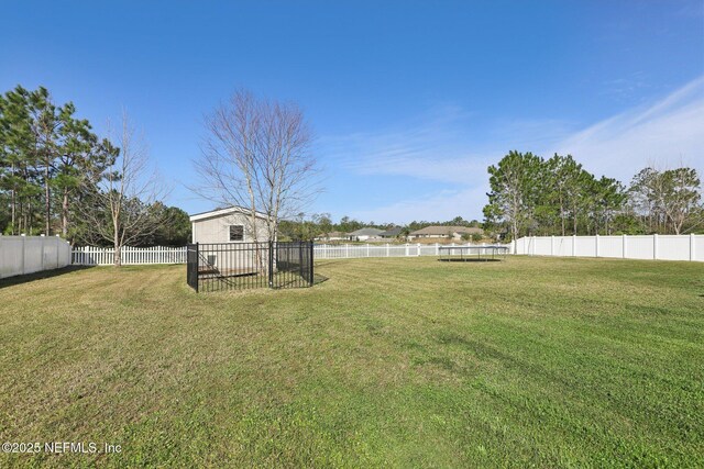 view of yard with a fenced backyard