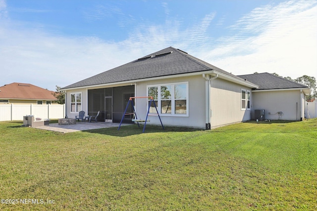 back of house with a patio, central AC, fence, a sunroom, and a lawn