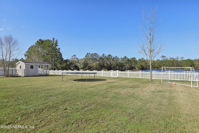 view of yard featuring a fenced backyard and an outdoor structure