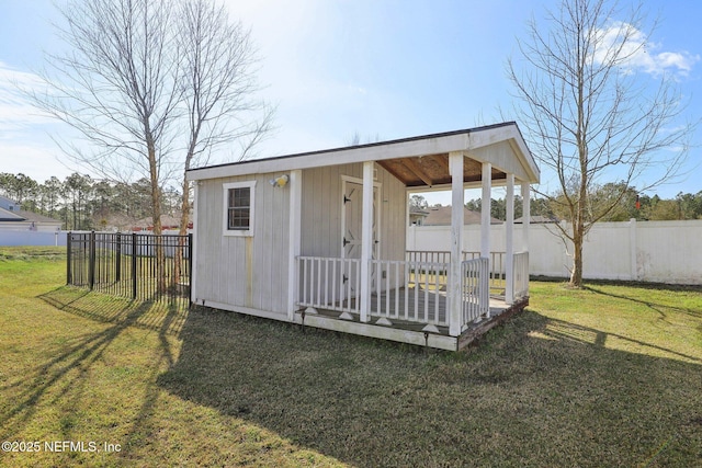 view of outbuilding with an outbuilding and fence