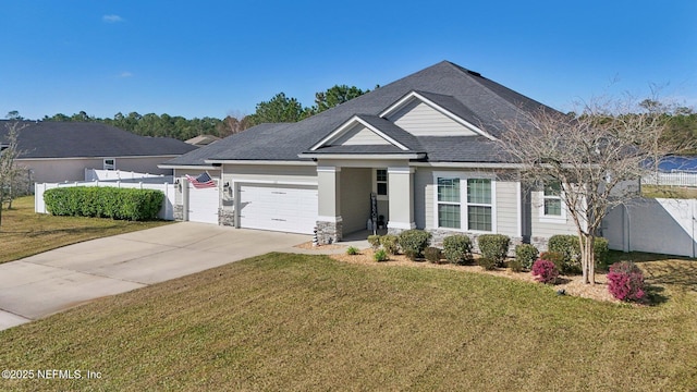 view of front of house with a garage, a front yard, driveway, and fence