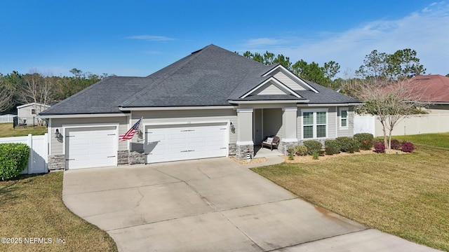 view of front of house with a garage, concrete driveway, stone siding, fence, and a front lawn