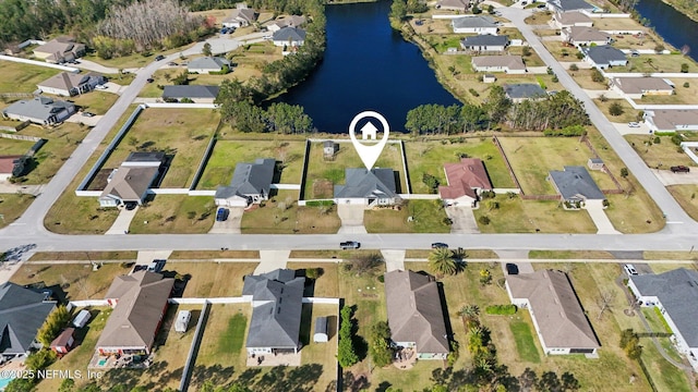 bird's eye view with a water view and a residential view