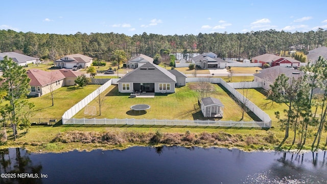 birds eye view of property featuring a residential view and a water view