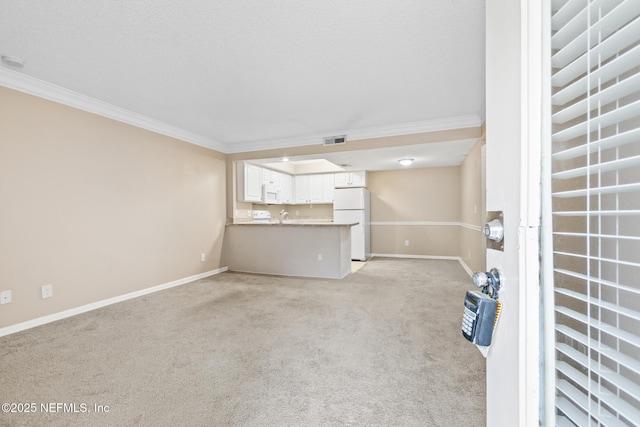 unfurnished living room featuring ornamental molding, visible vents, and light colored carpet