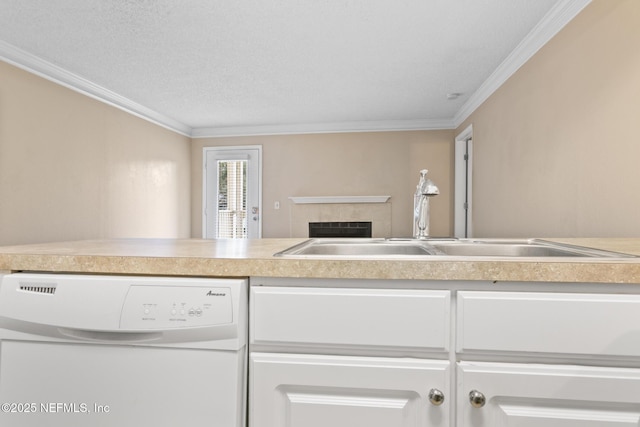 kitchen with light countertops, ornamental molding, white dishwasher, and a sink