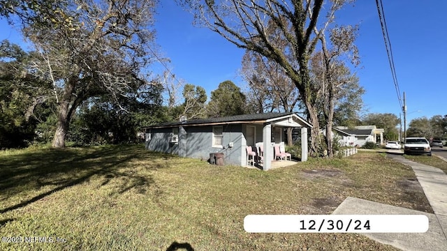 view of property exterior with a lawn