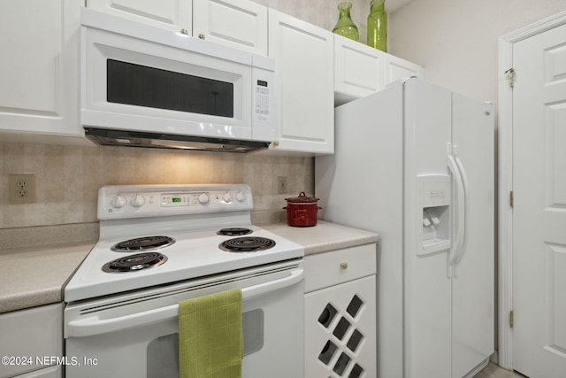 kitchen with light countertops, white appliances, white cabinetry, and tasteful backsplash