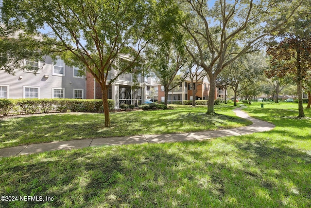 view of community featuring a lawn