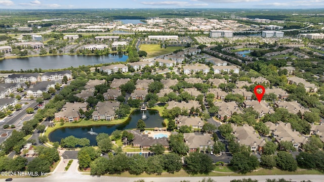 birds eye view of property with a residential view and a water view