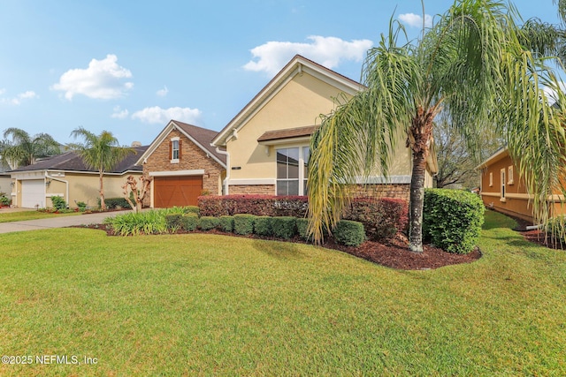 view of front of house featuring stucco siding, driveway, a front lawn, stone siding, and an attached garage