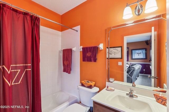 bathroom featuring vanity, toilet, and shower / bath combo with shower curtain