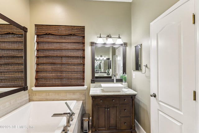 full bath featuring vanity and a bath