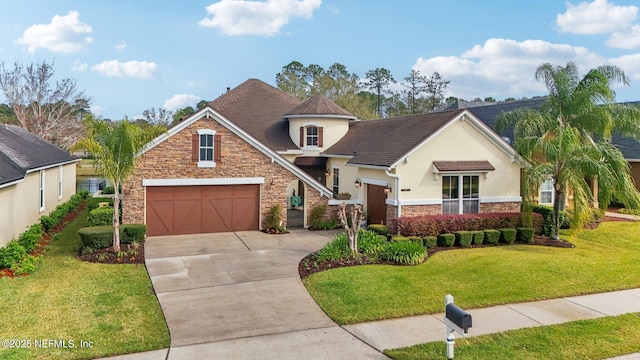 view of front of home with an attached garage, a front yard, stucco siding, stone siding, and driveway