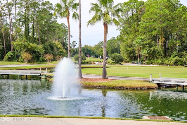 surrounding community featuring a water view