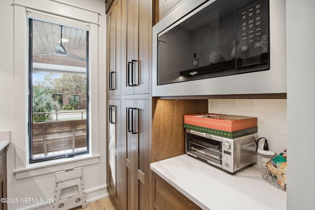 kitchen featuring a toaster and light wood-style flooring