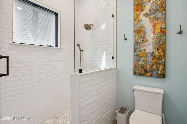 full bathroom with walk in shower and toilet