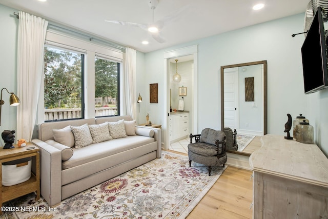 living area featuring recessed lighting and light wood-style floors