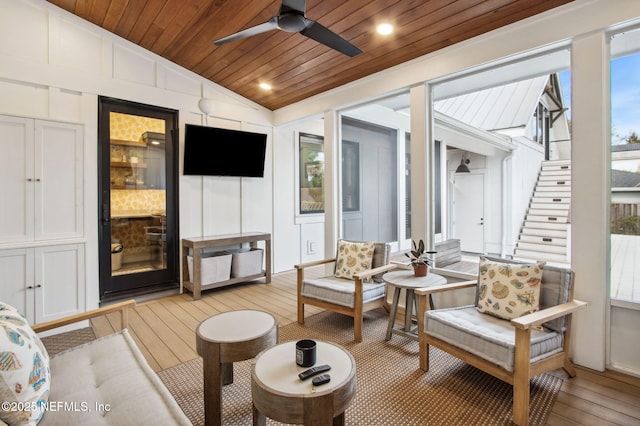 interior space featuring ceiling fan, wood ceiling, and vaulted ceiling