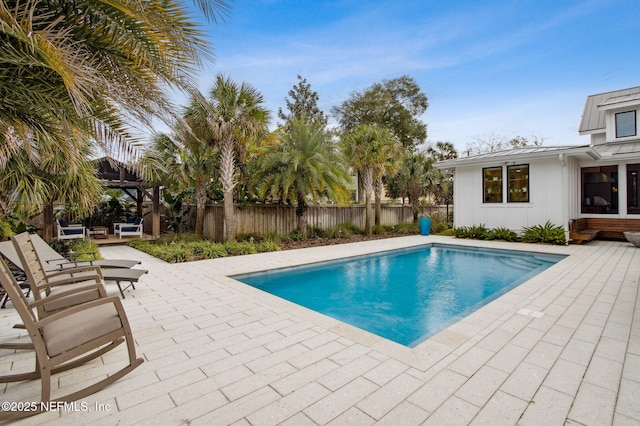 view of pool featuring a fenced in pool, a fenced backyard, and a patio