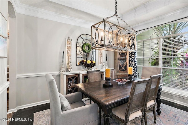 tiled dining room featuring baseboards, a healthy amount of sunlight, an inviting chandelier, and crown molding