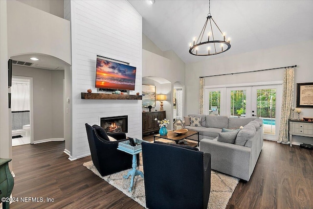 living room featuring arched walkways, high vaulted ceiling, a fireplace, and dark wood finished floors