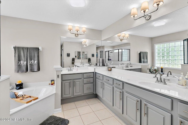 full bathroom with a stall shower, a garden tub, tile patterned flooring, a textured ceiling, and a sink