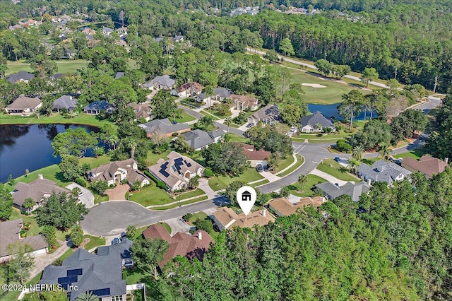 birds eye view of property featuring a water view and a residential view