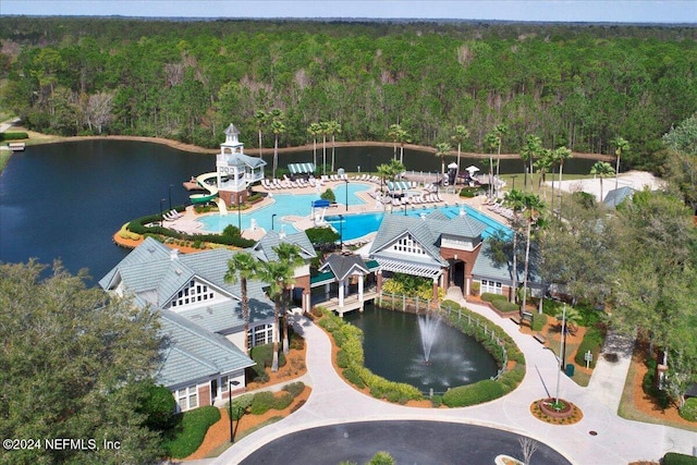 bird's eye view with a water view and a wooded view