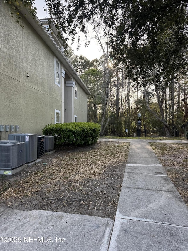 view of yard featuring central air condition unit