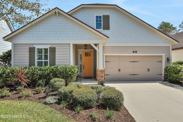 view of front of property featuring an attached garage and driveway