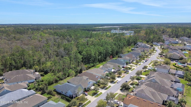 aerial view featuring a residential view and a view of trees