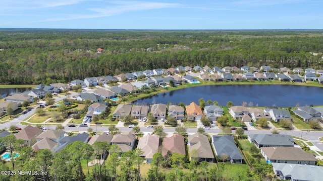 birds eye view of property with a residential view and a water view