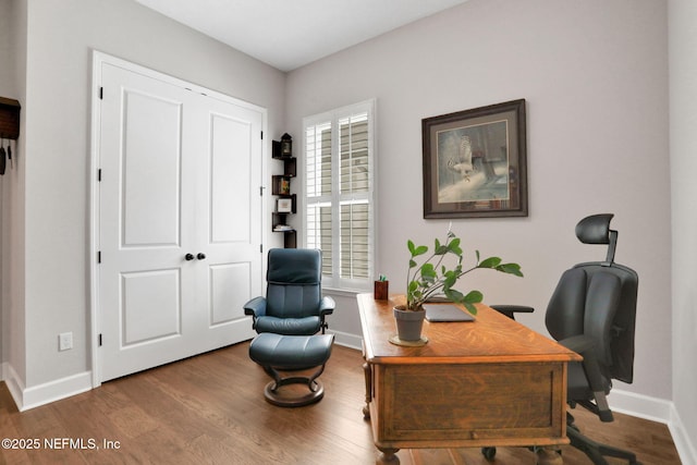 office featuring baseboards and wood finished floors