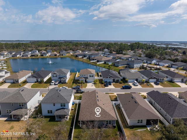 aerial view featuring a water view and a residential view