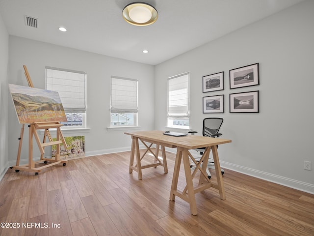 home office featuring baseboards, visible vents, wood finished floors, and recessed lighting