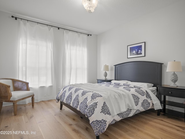 bedroom featuring wood finished floors