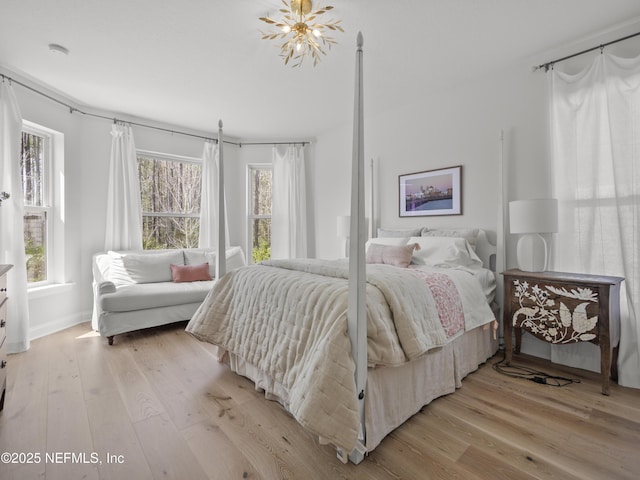 bedroom featuring light wood-style floors and multiple windows