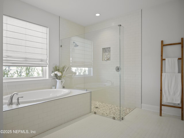 full bathroom with a garden tub, a tile shower, and tile patterned floors