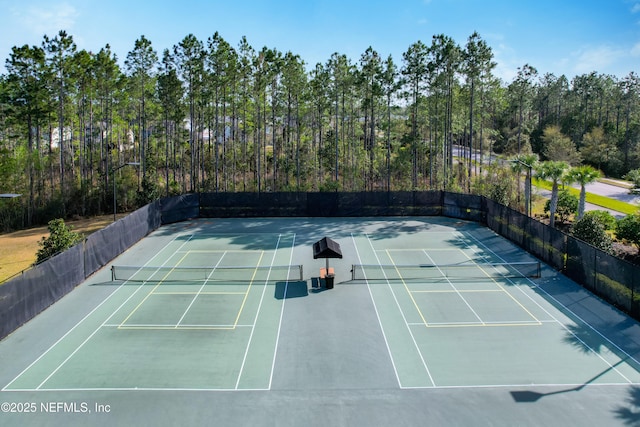 view of tennis court with fence