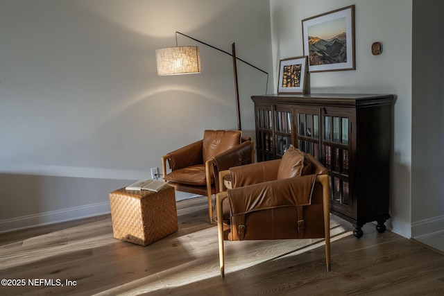 sitting room featuring wood finished floors and baseboards