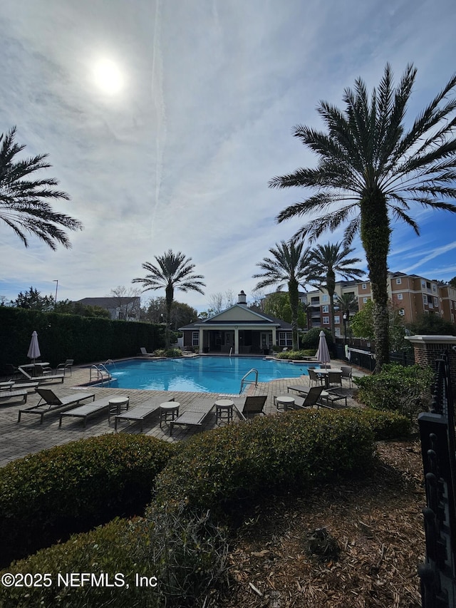 pool featuring a patio and a gazebo