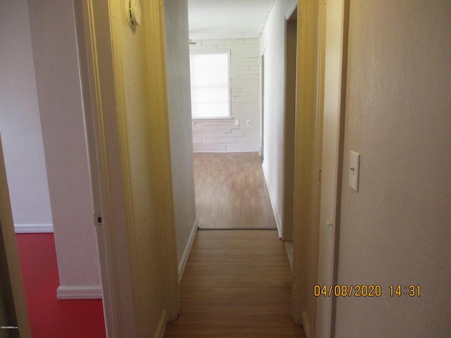 hallway with wood finished floors