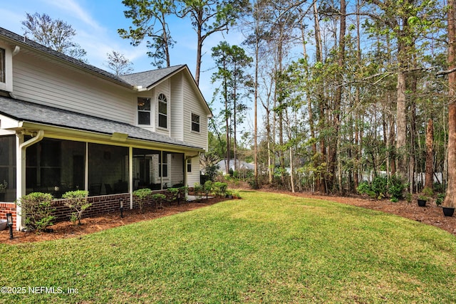 view of yard featuring a sunroom