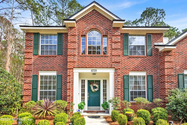 view of front of house with brick siding