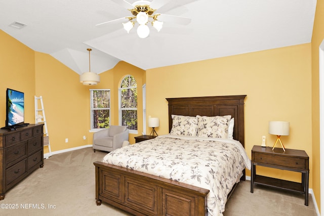 bedroom featuring ceiling fan, light colored carpet, visible vents, baseboards, and vaulted ceiling