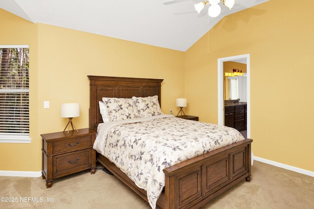 bedroom featuring a ceiling fan, light carpet, vaulted ceiling, and baseboards