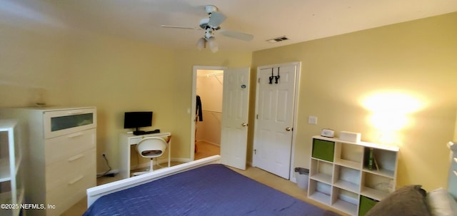 bedroom featuring a ceiling fan, visible vents, and a closet