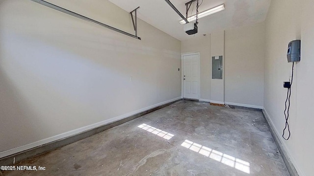 garage with electric panel and baseboards