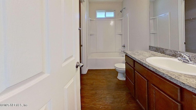 full bathroom with toilet, shower / tub combination, wood finished floors, and vanity